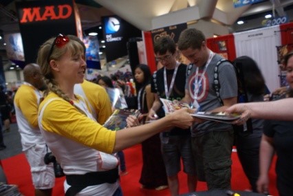 Spectra author Beck Thompson handing out comic books at Comic-Con International 2013